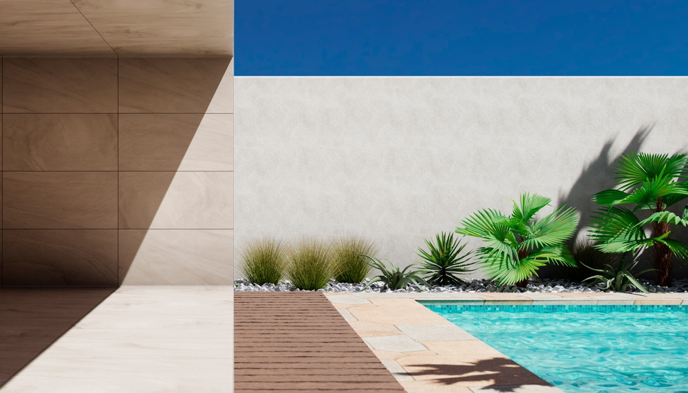 pool and stone wall with palms